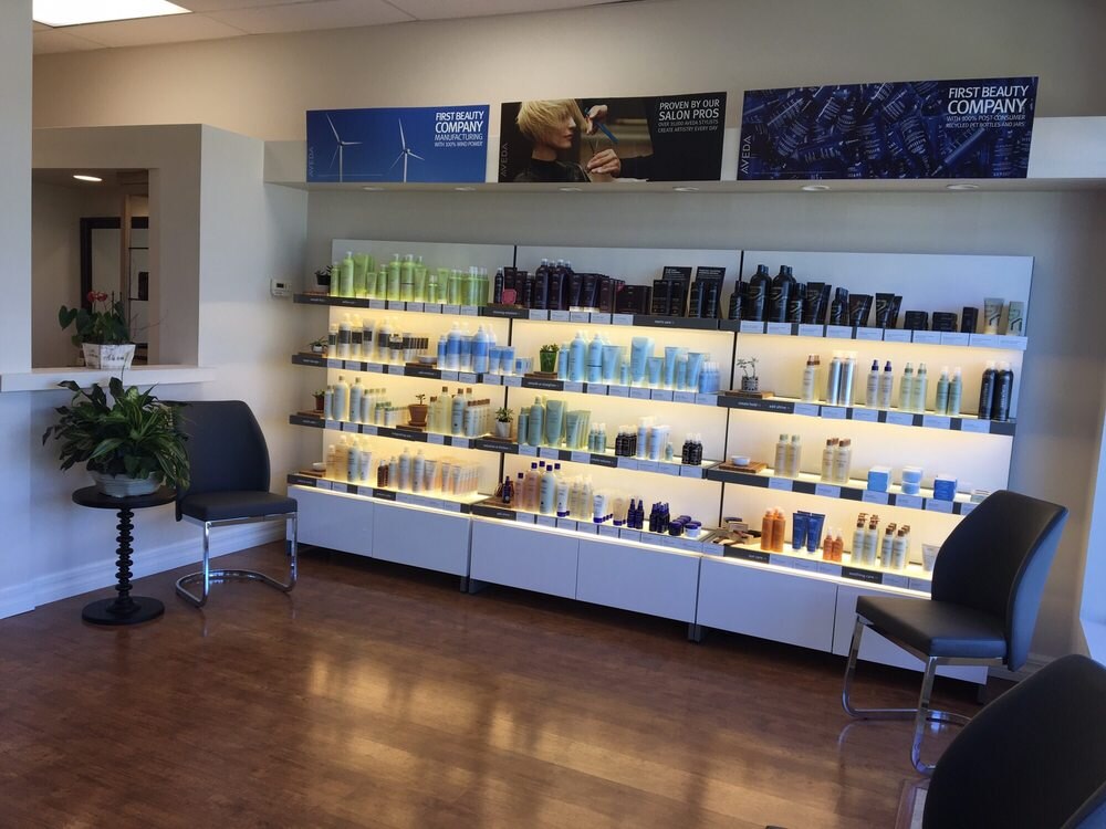 Aveda retail shelf at Salon Alvarez